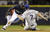Yuniesky Betancourt (izq.), durante un juego de los Marineros de Seattle y los Rangers de Texas, en Seattle, el 4 de mayo de 2009. (AP)