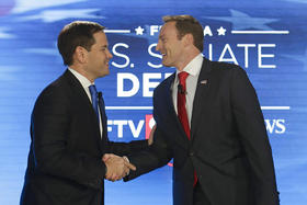 El senador republicano Marco Rubio (izq.) y el congresista demócrata Patrick Murphy