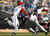El cubano Eduardo Paret (izq) y el japonés Seiichi Uchikawa en el segundo inning. PETCO Park, San Diego, California, 15 de marzo de 2009. (AP)