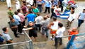 Turbas atacan a opositores en Río Verde