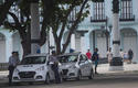 Dos patrullas de policía son vistas cerca del capitolio a dos días del aniversario del 11J, en La Habana, Cuba